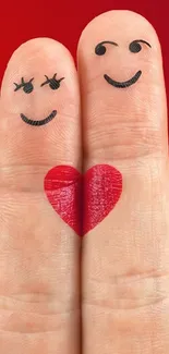 Two fingers with a drawn heart in red background