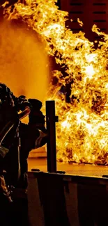 Firefighters tackling blazing flames at night