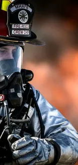 Firefighter wearing protective gear against fiery background.