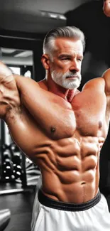 Elderly man displaying a muscular physique in a gym environment.