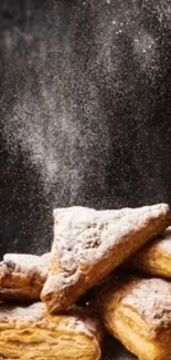 Golden brown pastries with sugar dusting.