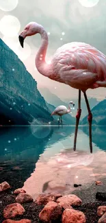 Two flamingos stand in a serene mountain lake reflecting vibrant scenery.