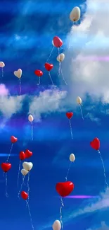 Heart-shaped balloons float beneath a blue sky scattered with white clouds.