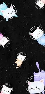 Cute cats floating in a starry space-themed wallpaper.