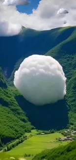 Serene green valley with floating cloud in scenic landscape.