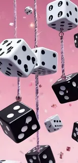 Black and white dice floating against a pink background.