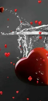 Red heart submerged in water with splashes.