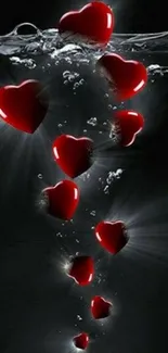 Floating red hearts in water wallpaper.