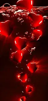 Red hearts floating underwater in a dark background, creating a romantic scene.