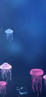 Jellyfish in deep sea wallpaper with pink and blue hues.