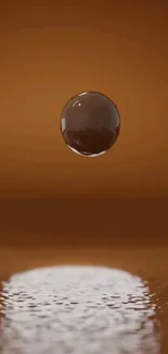 Brown orb floats over a reflective surface.