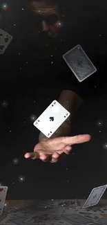 Floating playing cards in dark magical scene wallpaper.