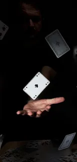 Floating playing cards with a dark backdrop.