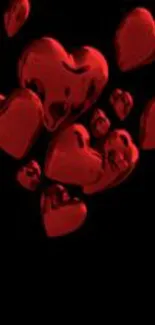 Floating red hearts on black background wallpaper.