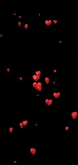 Mobile wallpaper with floating red hearts on black background.