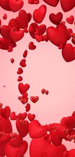 Floating red hearts on pink background.