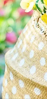 Wicker basket with yellow flowers and spring garden background.