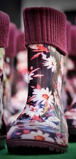 Colorful floral boots with burgundy trim in focus.