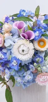 A vibrant floral bouquet wallpaper with blue and pastel flowers.