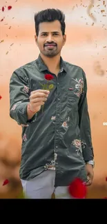 Man in a floral shirt holding a rose against a peach background.