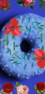 Blue floral donut with red flowers on dark blue background.