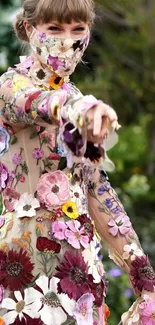 Person in a colorful floral dress with a nature backdrop.