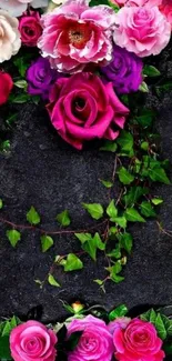 Vibrant floral wallpaper with pink and purple roses on a black background.