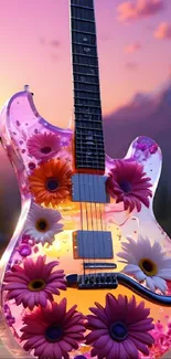 Guitar with flowers against a colorful sunset backdrop.