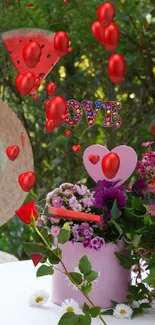 Floral table setup with hat and love sign in a garden setting.