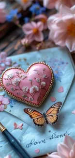 Heart ornament and butterfly on a floral letter.