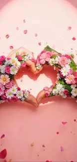 Hands forming a floral heart with roses and daisies.