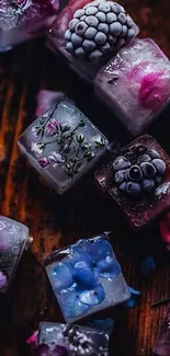 Ice cubes with embedded flowers on a wooden surface.