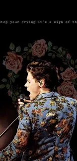 Musician in floral jacket singing with floral art background.