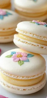 Elegant floral macarons with pastel colors on display.