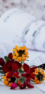 Colorful flowers on music sheets wallpaper.