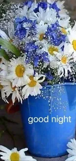 Blue vase with daisies and blue flowers, 'good night' text.