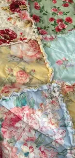 Vintage floral patchwork wallpaper in pastel tones.