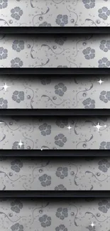 Gray floral pattern wallpaper with layered abstract design.