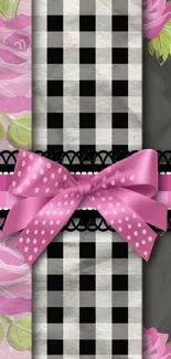 Pink bow on floral and plaid wallpaper.