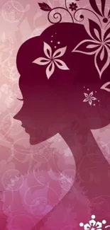 Mobile wallpaper with floral silhouette design in shades of pink.