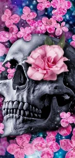 Skull adorned with pink flowers on a dark background.