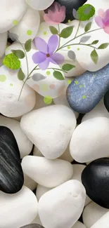 White and black stones with delicate purple flowers.