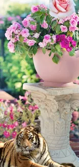 Tiger lying beside a pink flower pot in a lush garden.