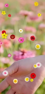 Hand with colorful flowers on pink background wallpaper.