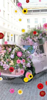 Vintage car covered in colorful flowers, set on a cobblestone street.