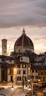 Florence skyline featuring a lit dome under a visually stunning dusk sky.