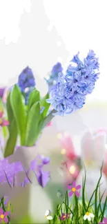 Vibrant purple hyacinths and spring flowers create a lively mobile wallpaper.