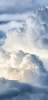 Fluffy white clouds in a blue sky phone wallpaper.