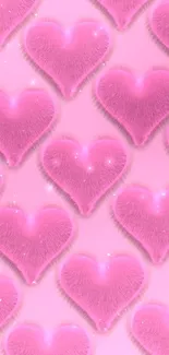 Mobile wallpaper with fluffy pink hearts on light pink background.