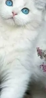 Fluffy white cat with blue eyes and lavender flowers.